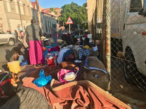 Photo of people on a pavement