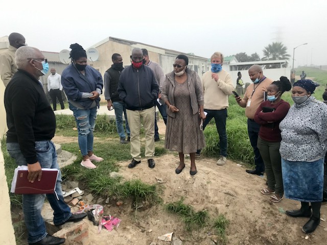 Photo of a group of people at a ditch