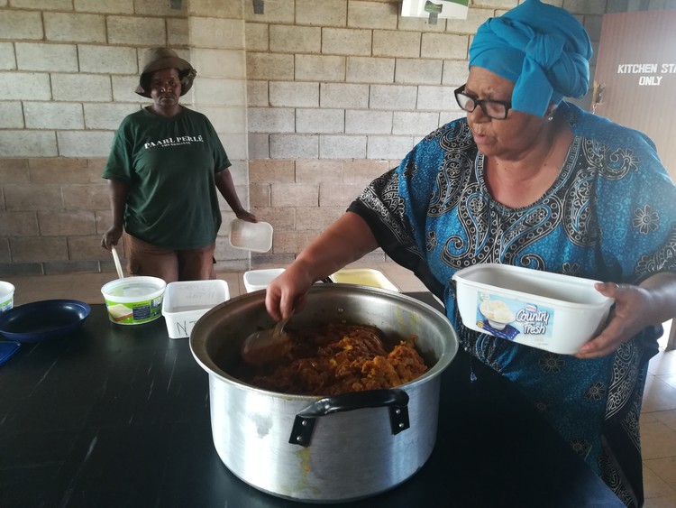 Photo of woman dishing out food