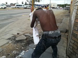 Boy washing himself