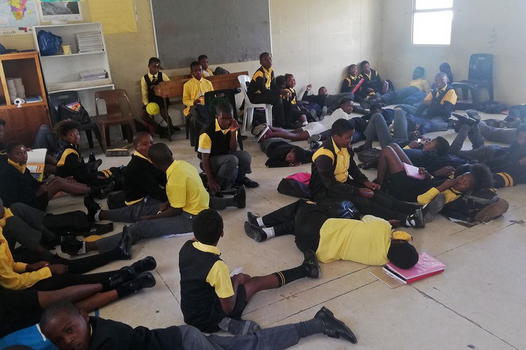 Photo of children on the floor in school