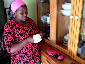 Photo of a woman sewing a shoe