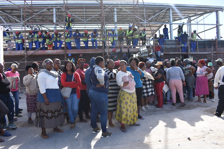 Photo of protesters on building site