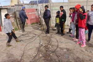 Photo of a group of people in a backyard