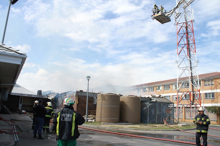 Photo of crane with firefighters