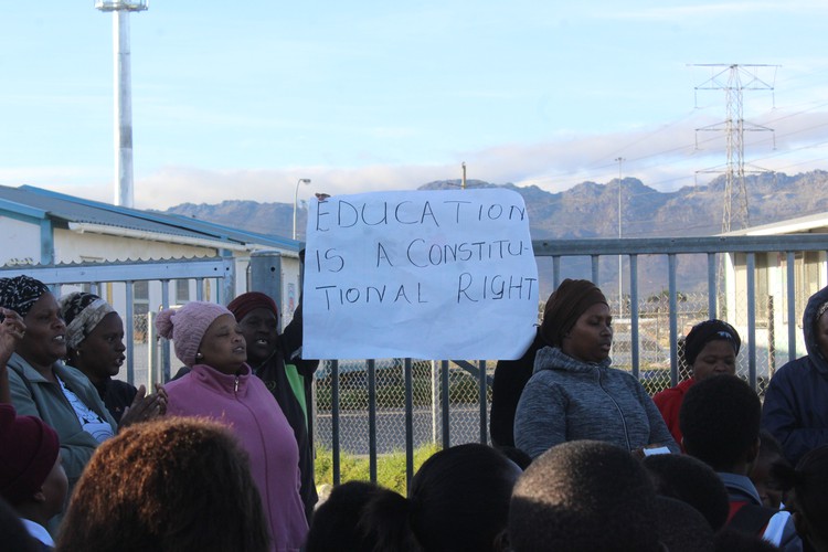 Photo of people outside gate