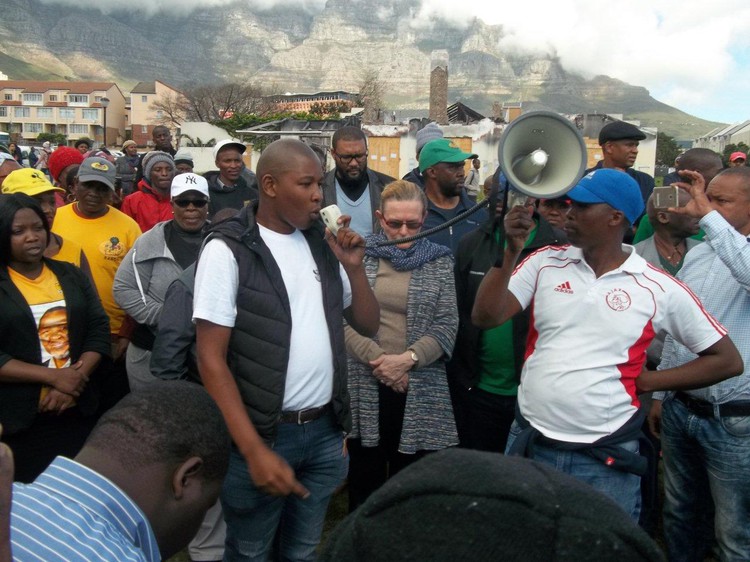 Photo of teachers gathering.