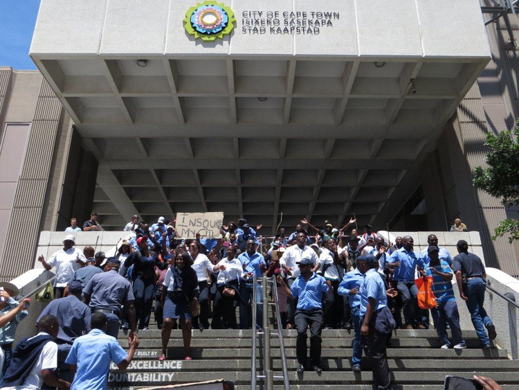 Photo of people standing on steps