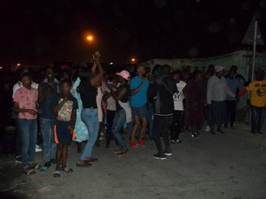 Photo of people in the street at night