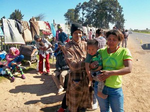 Photo of people by a roadside