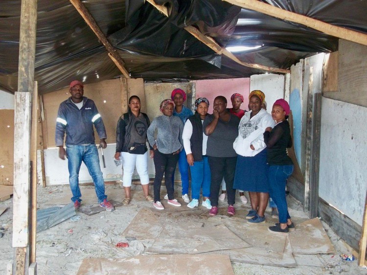 Photo of people in a shack