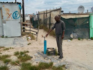 Photo of a man at a tap