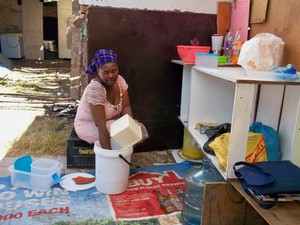 Photo of a woman washing up