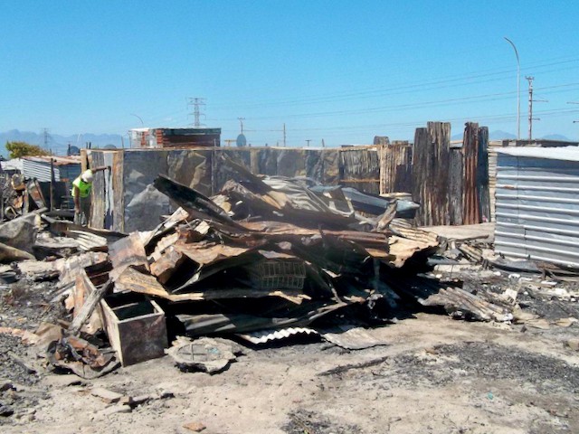 Photo of burnt shacks