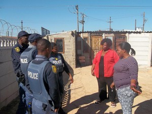 Photo of women talking to police