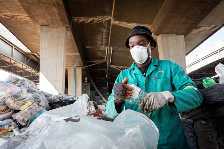 Photo of man sorting waste