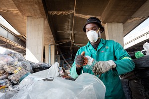 Photo of man sorting waste