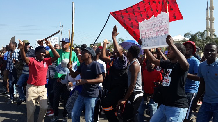 Photo of striking workers with banners