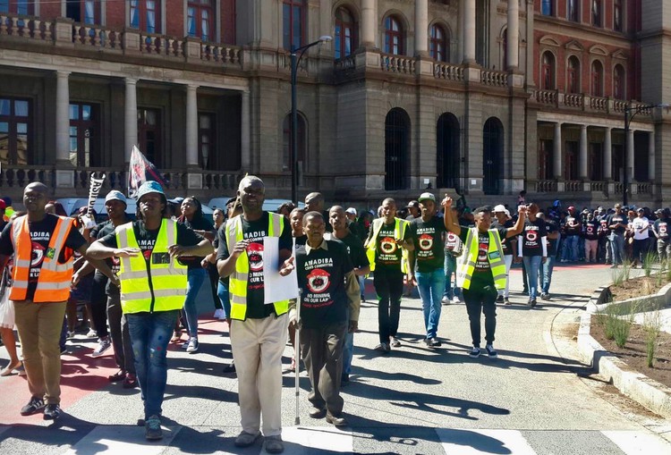 Photo of people marching in street