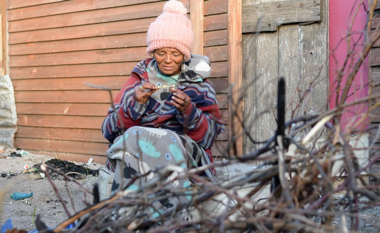 Photo of a woman rolling a cigarette