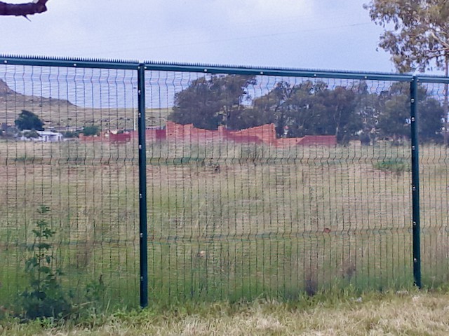 Photo of a fence for a stadium under construction