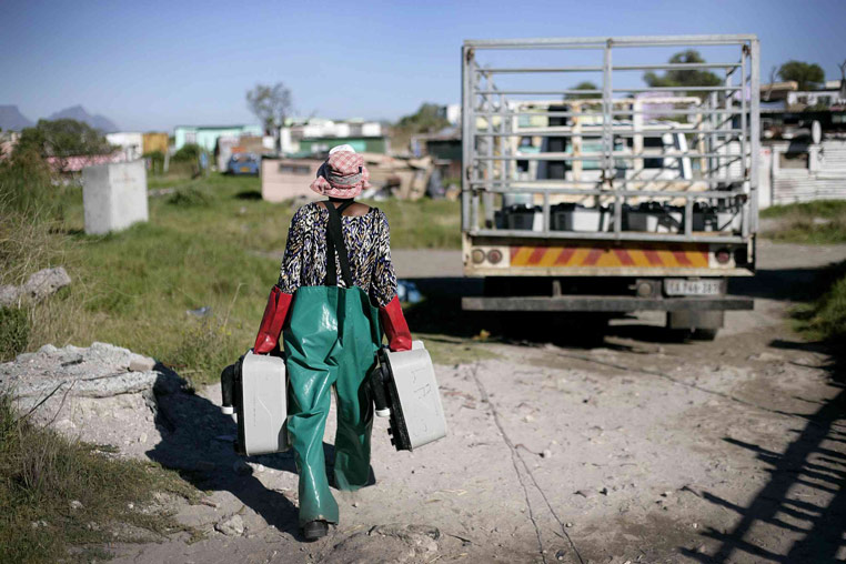  A worker load​s portable toilets onto a truck in Khayelitsha.