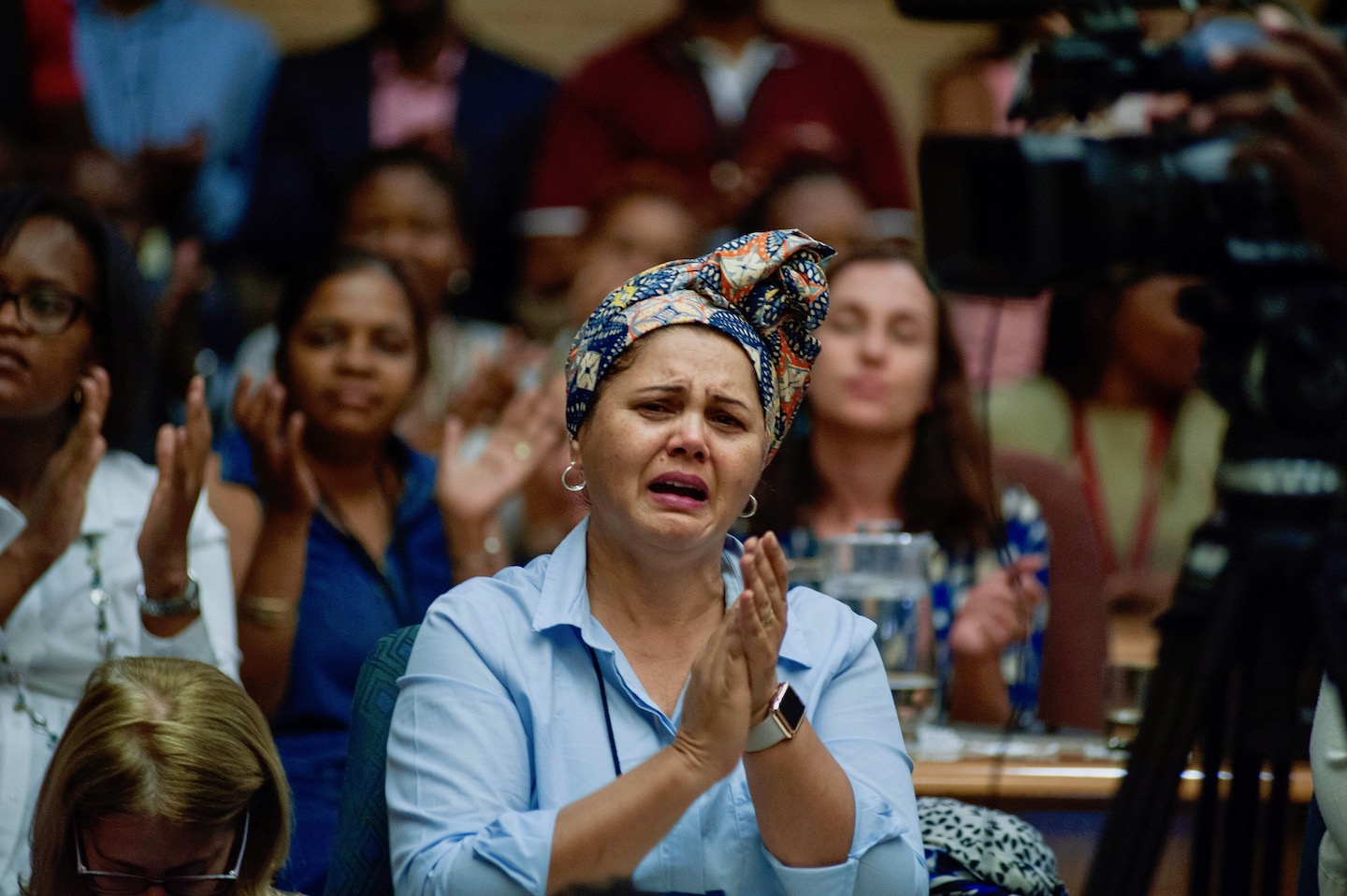 Photo of a woman applauding