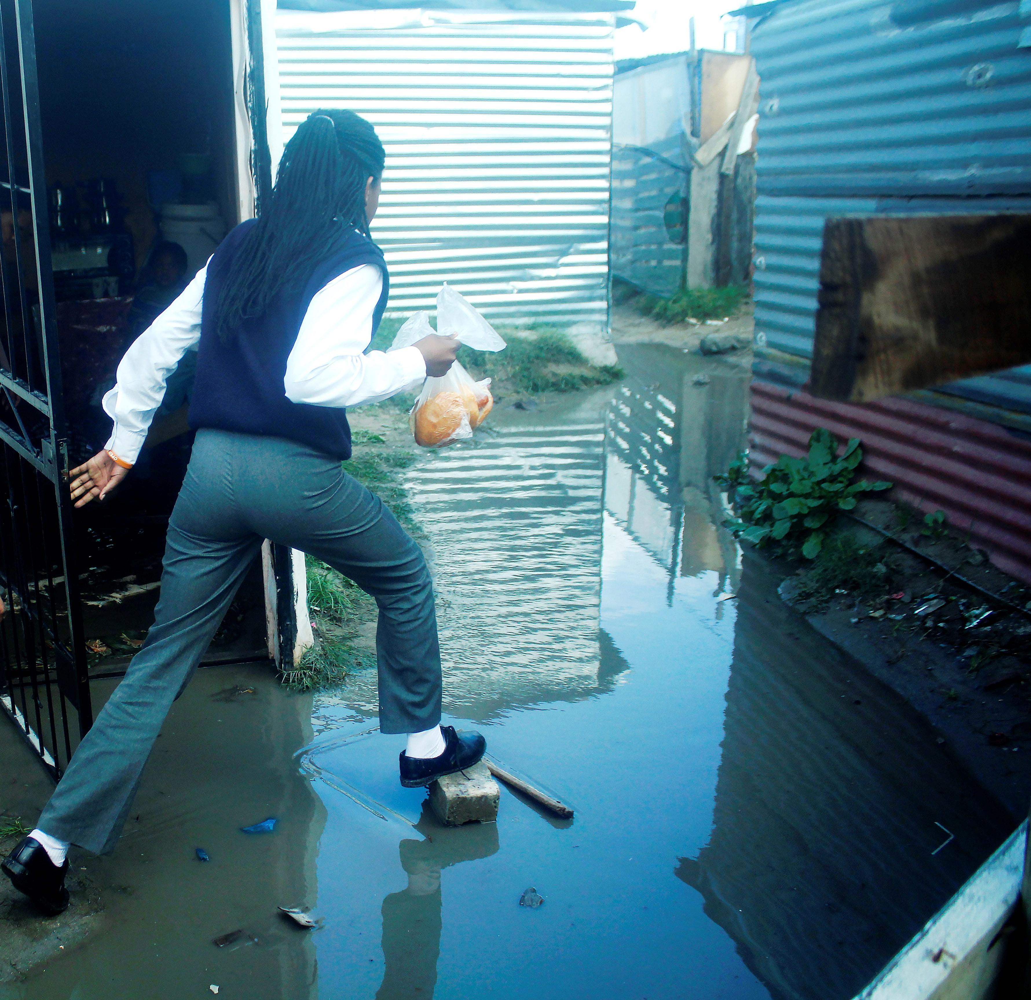 Photo of a woman stepping on stones