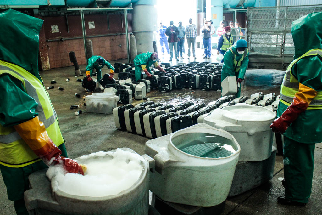 Photo of portable toilets being cleaned