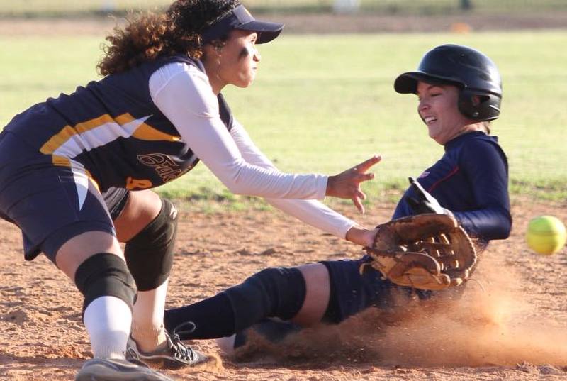 Photo of player sliding into base.