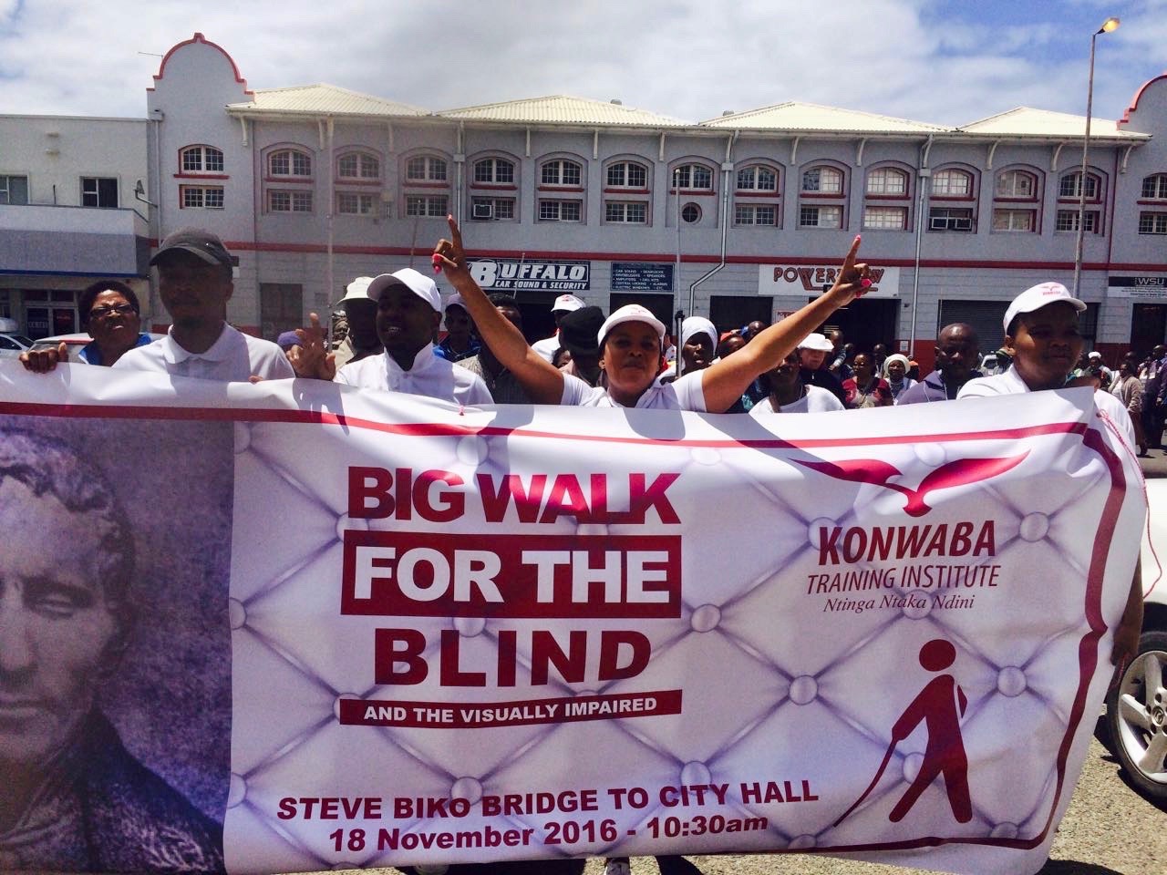 Photo of marchers with a banner