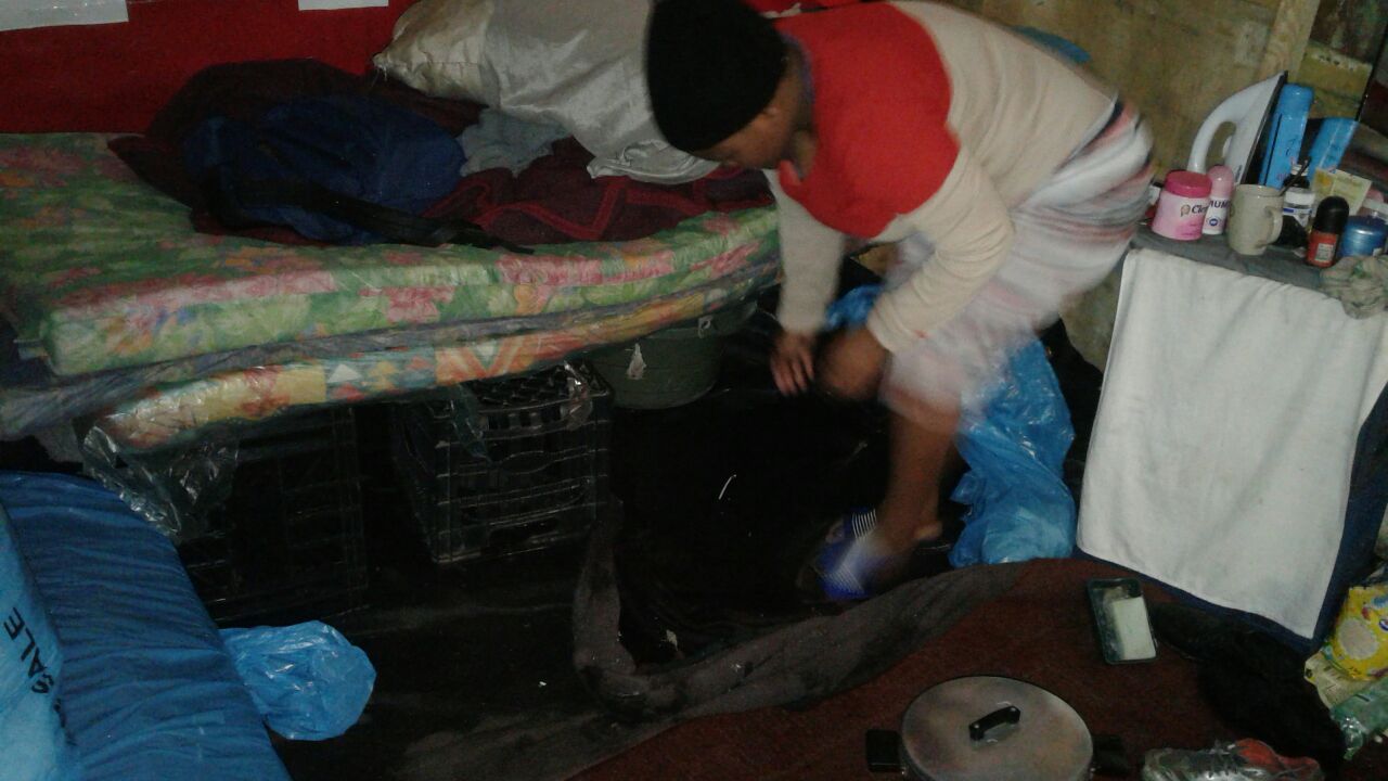 Photo of a woman in a flooded home