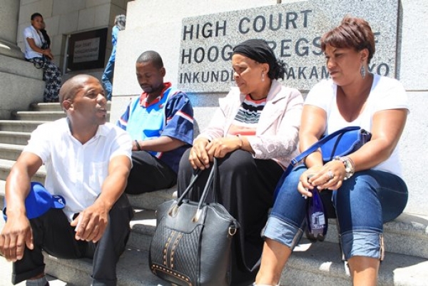 Photo of people sitting on court steps